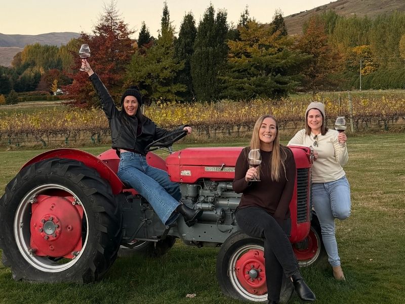 Friends enjoying an autumn wine tour in Central Otago